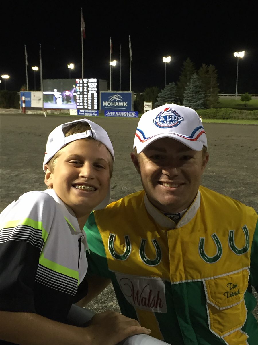 A young Robbie Coleman with harness racing driver Tim Tetrick at Mohawk Racetrack